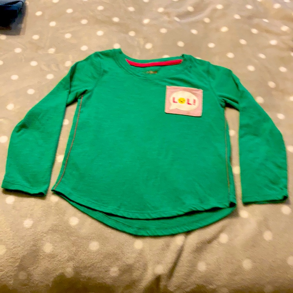 Very cute little girls long sleeve t shirt. With LOL on the pocket.